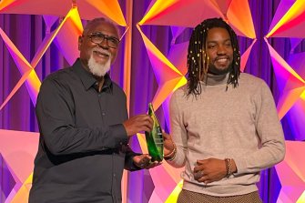 Michael Collins (left) receives the Charlotte Brody Award from Jeremiah Headen, U.S. climate and health campaigner with Health Care Without Harm at the 2024 CleanMed conference in Salt Lake City on May 21, 2024