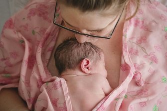 Mother holding her newborn